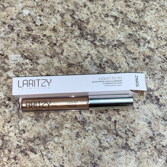 Laritzy Liquid Beam Multipurpose Illuminator Topaz - Picture 1 of 2